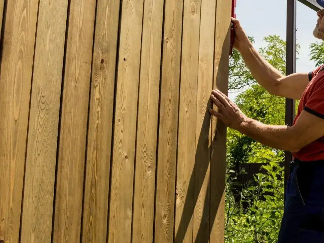Expert fence builder creating timber fence in Albury